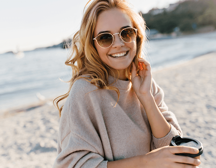Woman smiling at the beach